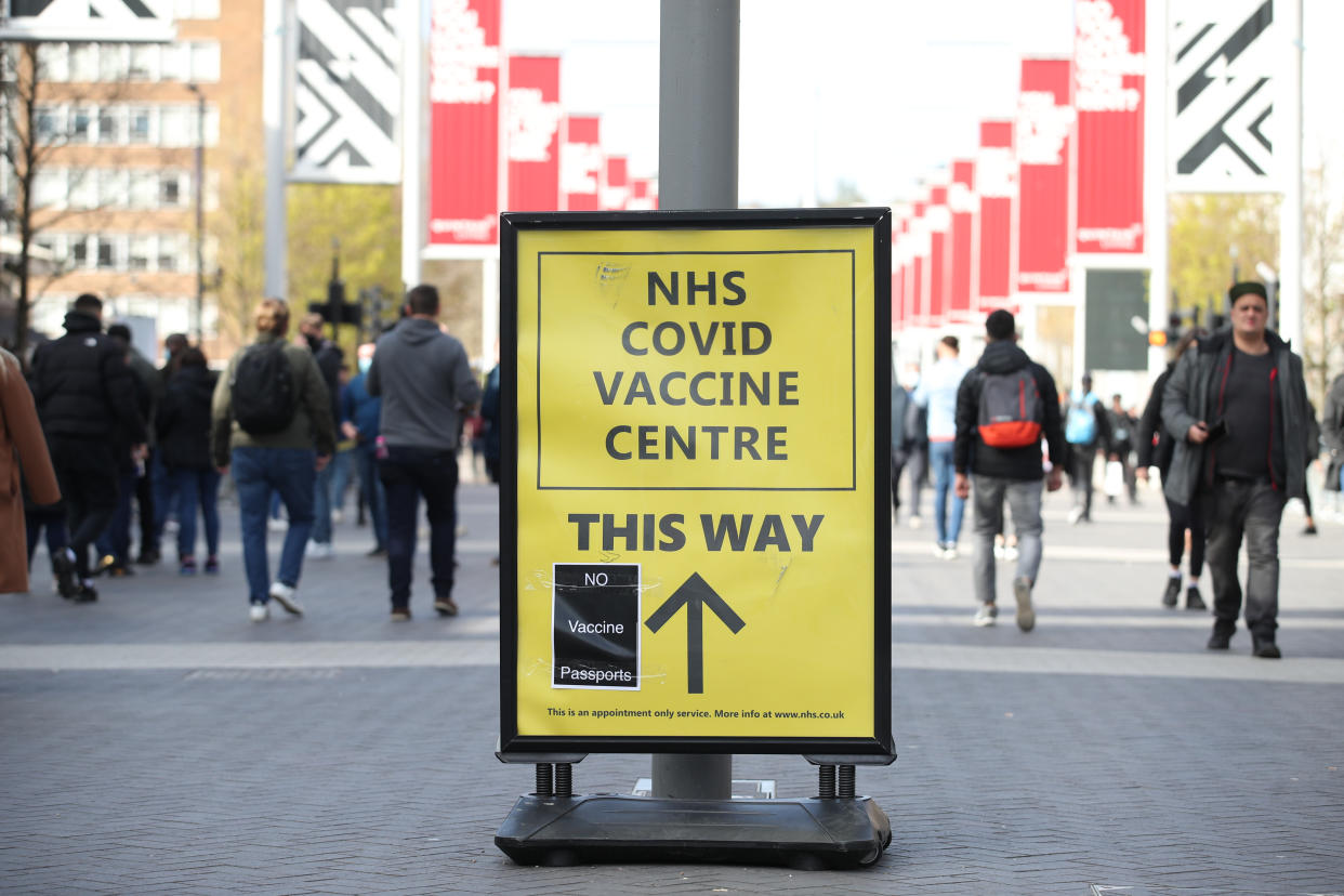 No Vaccine Passports protest sticker on a Vaccine Centre billboard outside Wembley Stadium, London, ahead of the Leicester v Southampton FA Cup semi-final, following the further easing of lockdown restrictions in England. Picture date: Sunday April 18, 2021. (Photo by Yui Mok/PA Images via Getty Images)