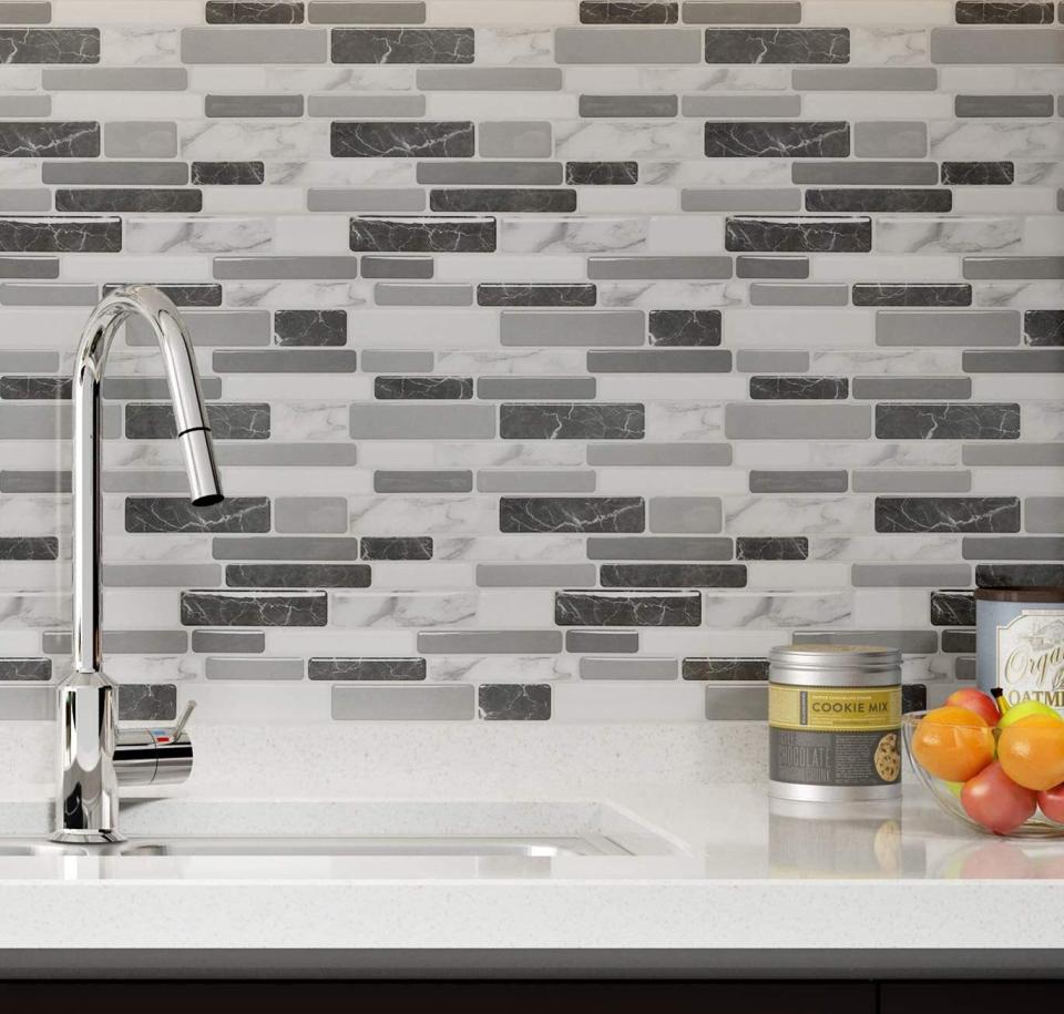 Your kitchen will look so fresh that you might wonder if it's really the same one you've had for years. The peel-and-stick backsplash is also mold-, heat- and moisture-resistant.<br /><br /><strong>Promising review:</strong> "We did a kitchen facelift this summer, repainting and making everything look fresh. We were looking at The Home Depot version of these, which are more than double the price. We decided to go for these instead and they are amazing!! I put them up myself in about two hours. I did buy the <a href="https://amzn.to/3e6QOWN" target="_blank" rel="nofollow noopener noreferrer" data-skimlinks-tracking="5723569" data-vars-affiliate="Amazon" data-vars-asin="B000PCWRMC" data-vars-href="https://www.amazon.com/dp/B000PCWRMC?tag=bfjasmin-20&amp;ascsubtag=5723569%2C15%2C31%2Cmobile_web%2C0%2C0%2C14870751" data-vars-keywords="cleaning" data-vars-link-id="14870751" data-vars-price="" data-vars-product-id="18042766" data-vars-product-img="https://m.media-amazon.com/images/I/312Py9nshKL.jpg" data-vars-product-title="3M General Purpose 45 Spray Adhesive, 10-1/4-Ounce, White" data-vars-retailers="Amazon">adhesive spray</a> just in case but it wasn&rsquo;t needed, even for the few I had to peel off and re-stick to center correctly. These aren&rsquo;t too difficult to apply but definitely require patience. 100% worth the buy for a DIY affordable update!" &mdash; <a href="https://amzn.to/3uXzQRn" target="_blank" rel="nofollow noopener noreferrer" data-skimlinks-tracking="5723569" data-vars-affiliate="Amazon" data-vars-href="https://www.amazon.com/gp/customer-reviews/R2K79UELAZILDG?tag=bfjasmin-20&amp;ascsubtag=5723569%2C15%2C31%2Cmobile_web%2C0%2C0%2C14870767" data-vars-keywords="cleaning" data-vars-link-id="14870767" data-vars-price="" data-vars-product-id="15955928" data-vars-retailers="Amazon">Hope Consilvio</a><br /><br /><strong>Get a 10-pack from Amazon for <a href="https://amzn.to/32lBeB3" target="_blank" rel="noopener noreferrer">$35.99</a> (visit the <a href="https://amzn.to/3eaV1Zy" target="_blank" rel="noopener noreferrer">shop page</a> for more colors including a <a href="https://amzn.to/3uRn72s" target="_blank" rel="noopener noreferrer">multicolor</a> one, a <a href="https://amzn.to/2RynkcA" target="_blank" rel="noopener noreferrer">white marble</a> one and a <a href="https://amzn.to/3uZiLXs" target="_blank" rel="noopener noreferrer">brown</a> one).</strong>