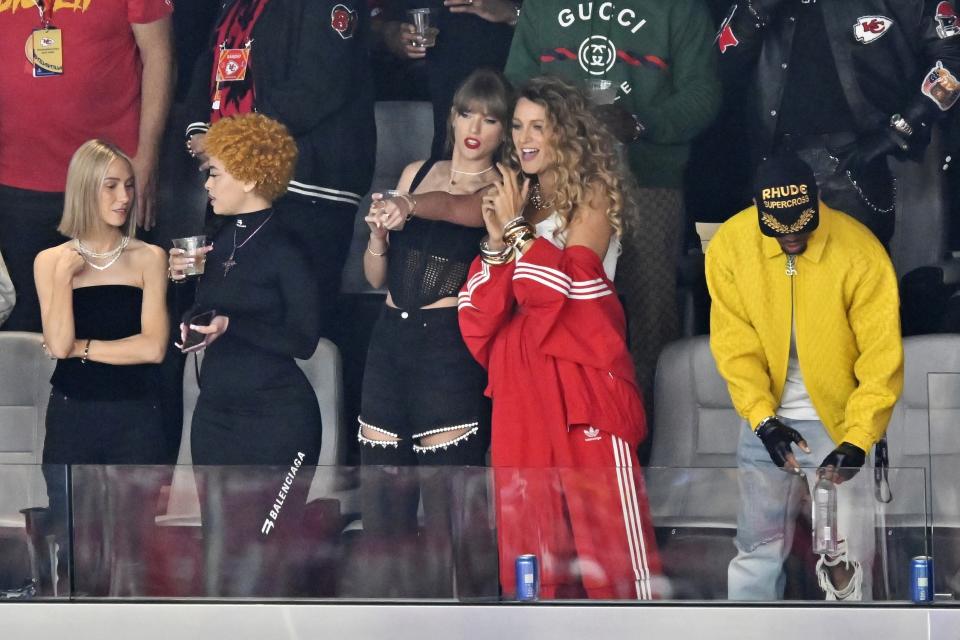 Ashley Avignone, from left, Ice Spice, Taylor Swift and Blake Lively talk before the NFL Super Bowl 58 football game between the San Francisco 49ers and the Kansas City Chiefs on Sunday, Feb. 11, 2024, in Las Vegas. (AP Photo/David Becker)