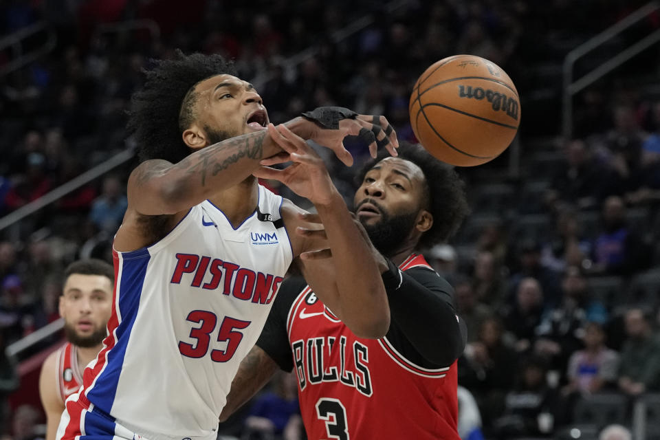 Chicago Bulls center Andre Drummond (3) fouls Detroit Pistons forward Marvin Bagley III (35) during the first half of an NBA basketball game, Wednesday, March 1, 2023, in Detroit. (AP Photo/Carlos Osorio)