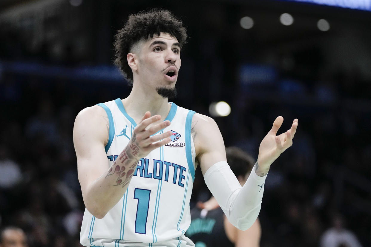 Charlotte Hornets guard LaMelo Ball (1) reacts during an NBA basketball game against the Washington Wizards, Friday, Nov. 10, 2023, in Washington. (AP Photo/Mark Schiefelbein)