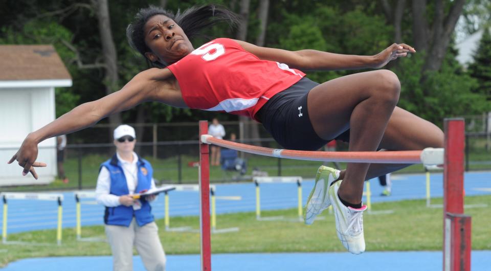 Smyrna's Raven Luckett clears 5'0" to win the high jump at DIAA state meet in 2013.