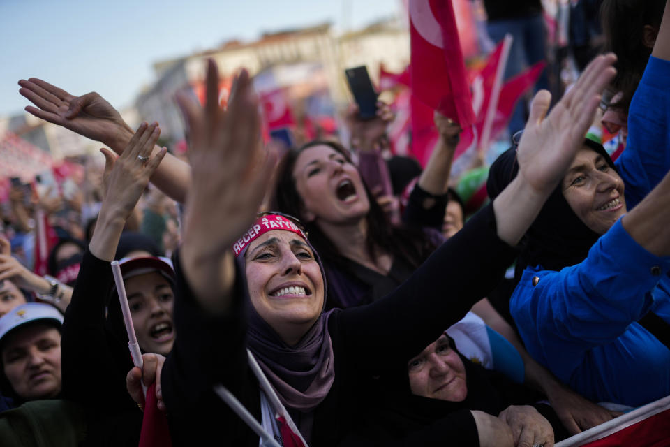 Supporters of Turkish President and People's Alliance's presidential candidate Recep Tayyip Erdogan react as they listen to him during a campaign rally in Istanbul, Turkey, Friday, May 26, 2023. (AP Photo/Francisco Seco)