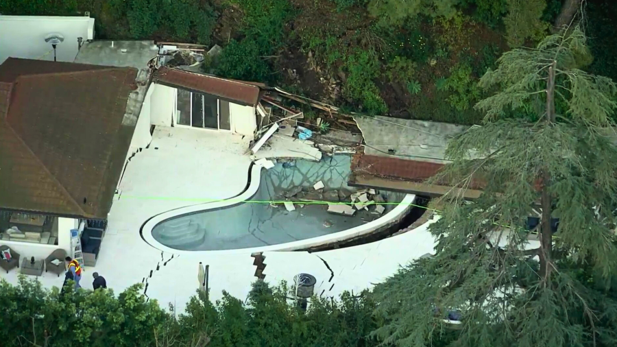 A landslide tore through the backyard of a home in Sherman Oaks on March 13, 2024. (KTLA)