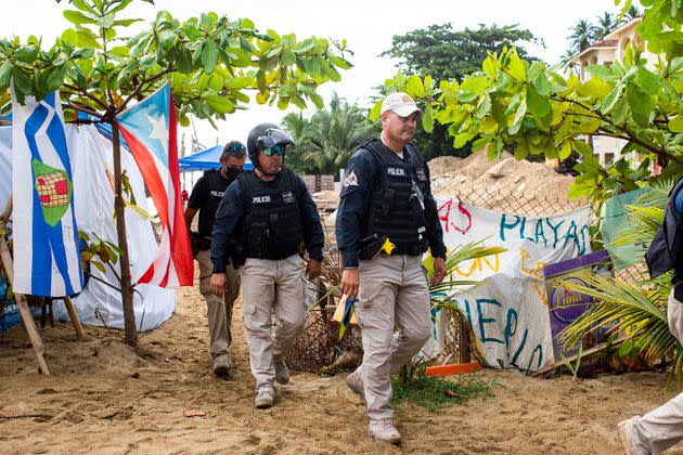 Police change shifts as they stand guard at the construction site. (Photo: Erika P. Rodriguez for HuffPost)