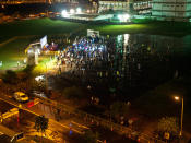 Rallygoers were sparsely packed in the big field because of the poor turnout. (Yahoo! photo/Alvin Ho)