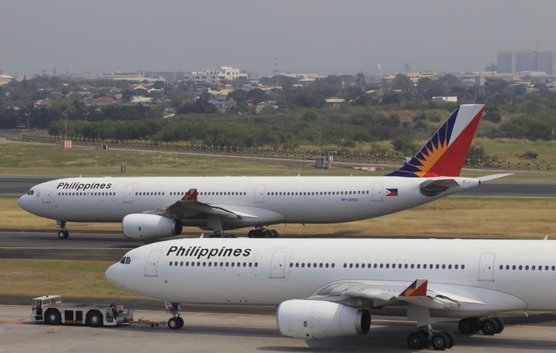 FILE PHOTO: Aircrafts of Philippines Airlines (PAL), the southeast asian nation's flag carrier taxiing at a runway of the Ninoy Aquino International Airport (NAIA) in Manila