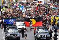 Police escort people joining a march with Aboriginal protesters on Australia Day in central Brisbane, Australia, January 26, 2017. AAP/Dan Peled/via REUTERS