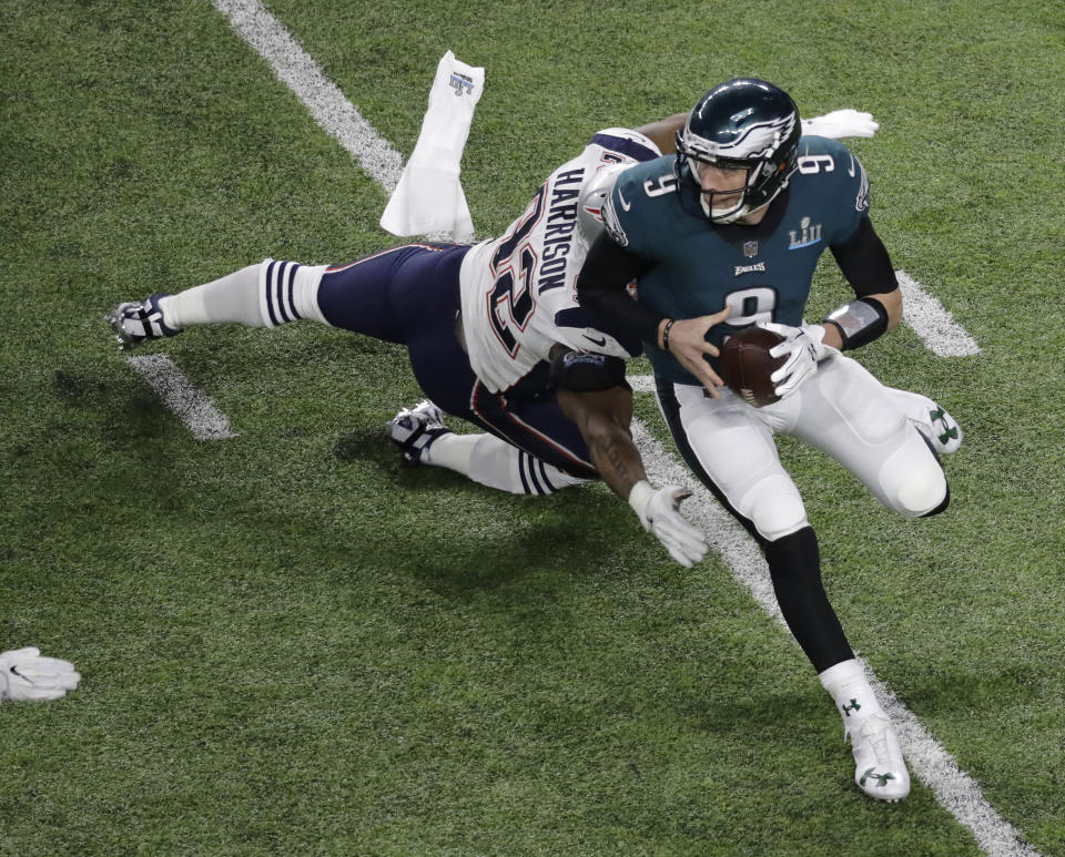 <p>Philadelphia Eagles quarterback Nick Foles (9) runs around New England Patriots outside linebacker James Harrison during the first half of the NFL Super Bowl 52 football game Sunday, Feb. 4, 2018, in Minneapolis. (AP Photo/Eric Gay) </p>