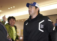 Seattle Mariners pitcher Yusei Kikuchi walks upon his team's arrival at Haneda international airport in Tokyo Friday, March 15, 2019. The Mariners will play in a two-baseball game series against the Oakland Athletics to open the Major League season on March 20-21 at the Tokyo Dome. (AP Photo/Eugene Hoshiko)