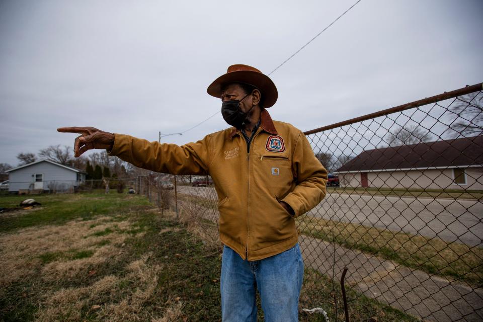 Pictured in March, Marvin Crayton looks over a garden he manages outside his home in the LaSalle Park Neighborhood.