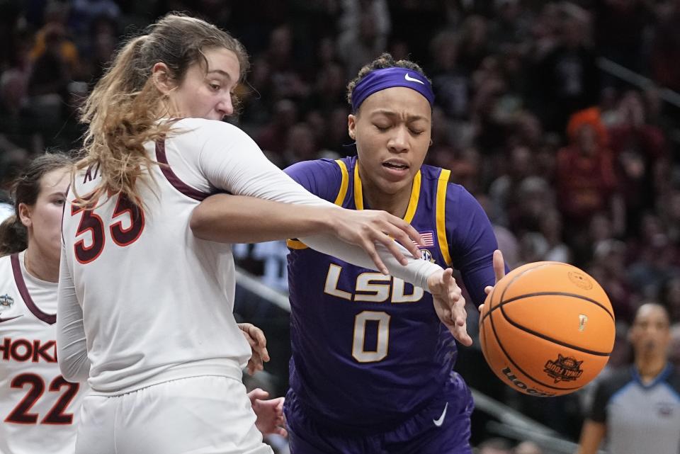 Virginia Tech's Elizabeth Kitley and LSU's LaDazhia Williams go after a loose ball during the second half of an NCAA Women's Final Four semifinals basketball game Friday, March 31, 2023, in Dallas. (AP Photo/Darron Cummings)