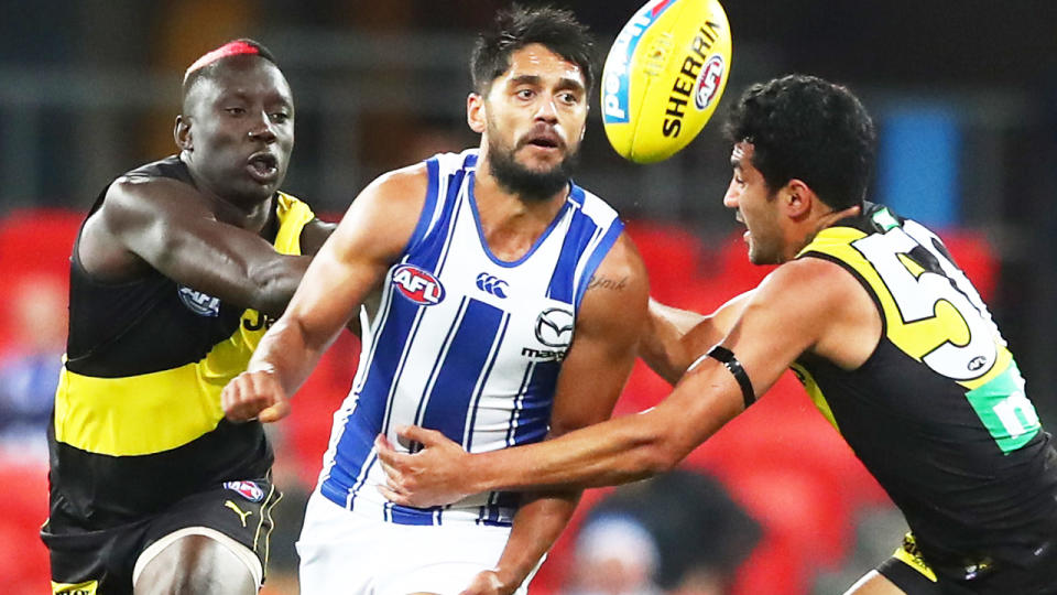 Aaron Hall, pictured here in action for North Melbourne in the AFL.