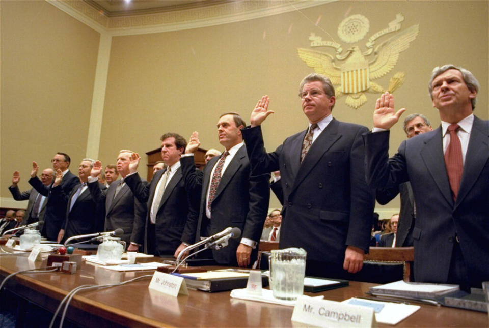 The heads of the nation’s largest tobacco companies attend a 1994 congressional hearing about the contents of cigarettes. The success of state litigation against the tobacco industry helped transform the role of attorneys general. (Photo by John Duricka/Associated Press)