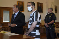 Hadi Matar, 24, center, listens to his public defense attorney Nathaniel Barone, left, addresses the judge while being arraigned in the Chautauqua County Courthouse in Mayville, NY., Saturday, Aug. 13, 2022. Matar, accused of carrying out a stabbing attack against “Satanic Verses” author Salman Rushdie, has entered a not-guilty plea on charges of attempted murder and assault. (AP Photo/Gene J. Puskar)