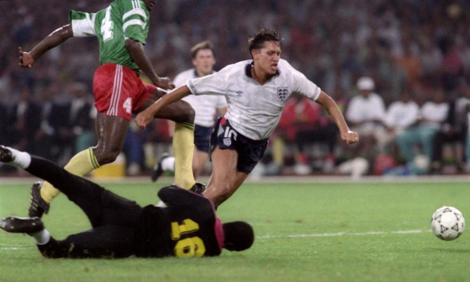 Gary Lineker goes down in the area to win England a penalty against Cameroon.