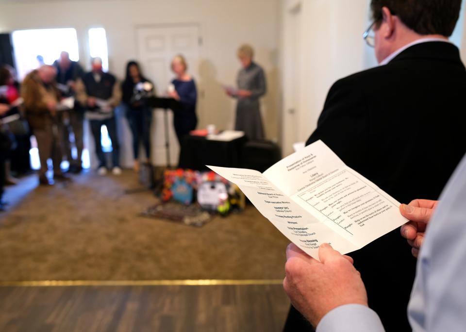 A litany is recited during the dedication of the final home in Central Oklahoma Habitat for Humanity's Stephen Florentz Legacy Estates addition in northwest Oklahoma City.