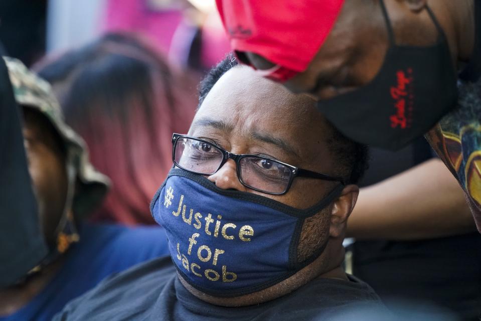 Jacob Blake's father, Jacob Blake Sr. wears a justice for Jacob mask at a rally Saturday, Aug. 29, 2020, in Kenosha, Wis. (AP Photo/Morry Gash)