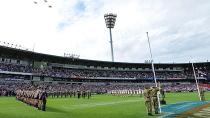 Fremantle and Carlton players commemorate.