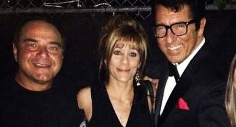 Michelle Weissman, 56, is pictured with two other men.