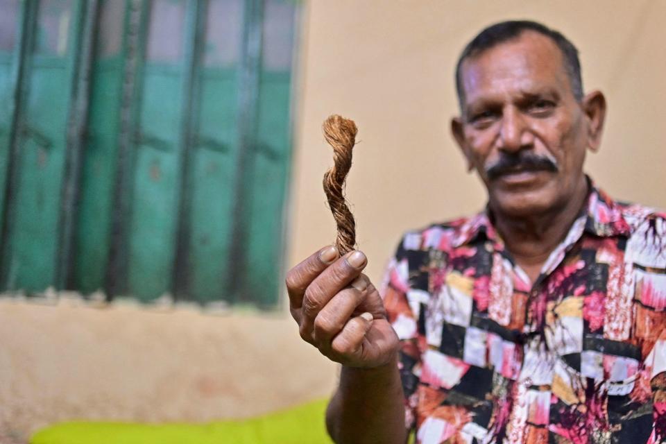 In this photo taken on October 19, 2023, hangman Shahjahan Bouya shows a snip of manila rope used for hanging condemned prisoners, during an interview with AFP at his house in Keraniganj, a Dhaka suburb.  / Credit: MUNIR UZ ZAMAN/AFP via Getty Images