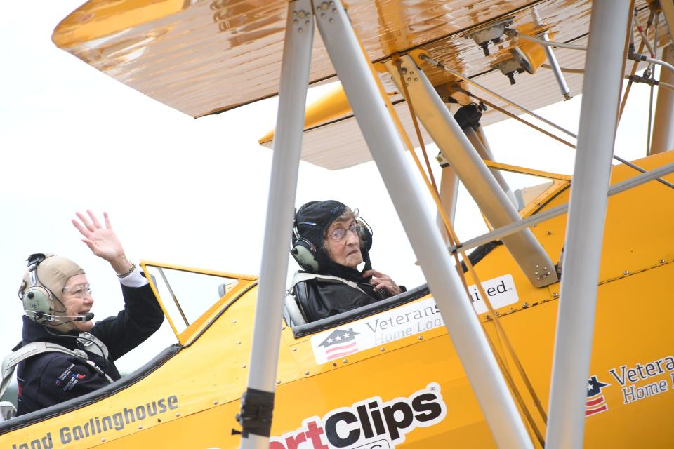 Molly Littlefield (left), Dream Flights pilot, gives Eloise Marler, 95, a ride aboard a restored, open-cockpit Stearman biplane, the same kind used to train aviators during World War II. Dream Flights partnered with Central Management which owns several nursing homes in the area to give flights to nursing home veterans and their families. Marler's late husband Joe Marler, Sr., was a World War II veteran who served in the Navy.