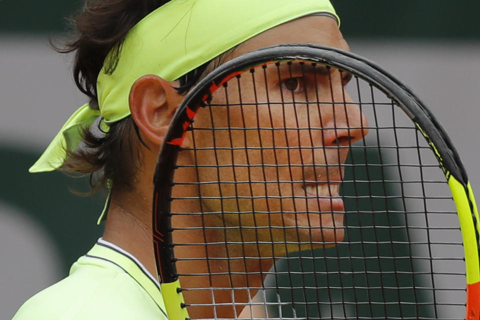 FILE - In this June 7, 2019 file photo, Spain's Rafael Nadal grimaces after scoring against Switzerland's Roger Federer during their semifinal match of the French Open tennis tournament at Roland Garros stadium in Paris, June 7, 2019. (AP Photo/Michel Euler, File)