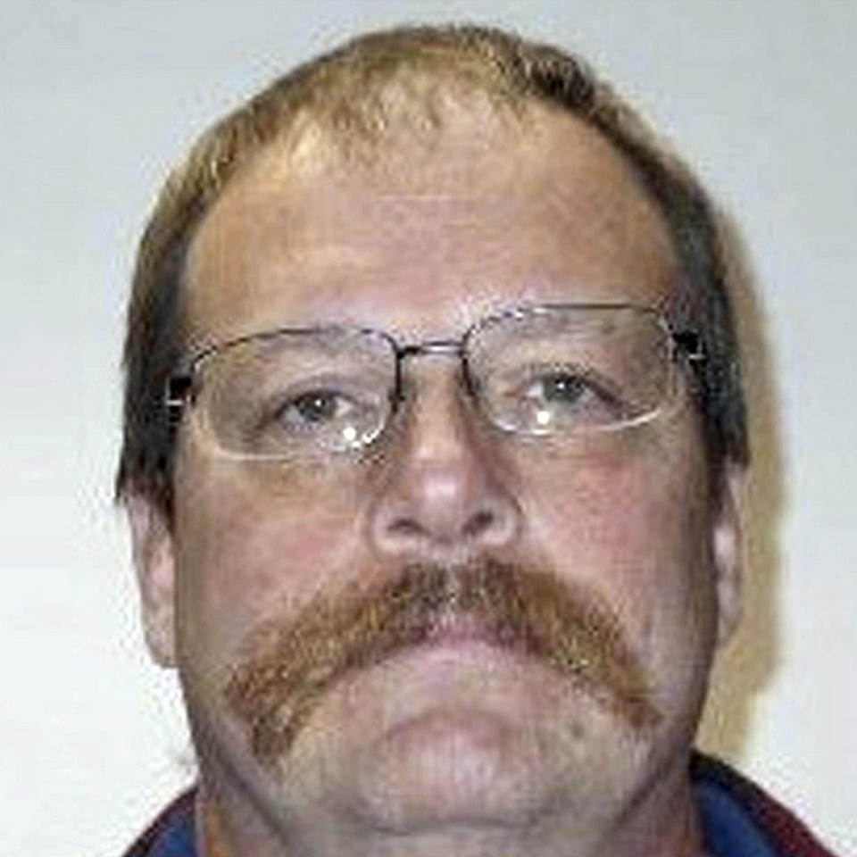 Michael Wolfe, 52, pictured with a distinct walrus moustache.