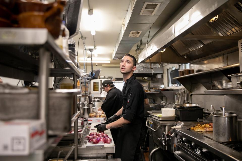 Chef Joseph Lanier preps a dinner order at The Jolly Onion Inn in Pine Island, NY on September 22, 2021.