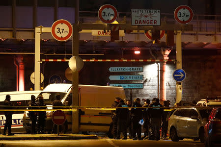 French special police forces secure an area during a police operation where the suspected gunman, Cherif Chekatt, who killed three people at a Christmas market in Strasbourg, was killed, in the Meinau district in Strasbourg, France, December 13, 2018. REUTERS/Christian Hartmann .