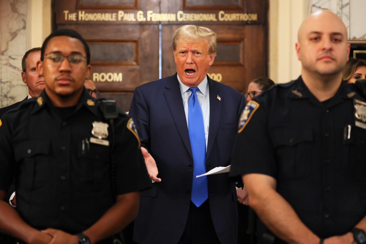 Former President Donald Trump speaks while the court takes a lunch recess during the first day of his civil fraud trial at New York State Supreme Court (Getty Images)