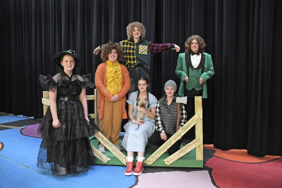 Students in the Green Middle School production of "The Wizard of Oz" include Carly Curtis (Miss Elmira Gultch/Wicked Witch), front left, Malayna Turpin (Zeke/Lion), Aleena Mast (Dorothy), Archie (Toto), Macayden Tapp (Hickory/Tinman), Anija Indermuhle (Hunk/Scarecrow), back left and Austin Sanderson (Prof Marvel/Wizard of Oz).