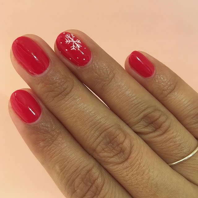 <p>If the only thing you like to change about manicures is your polish color, I gotchu. Instead of nail art on every single nail, try dotting little white snow flecks over festive <a href="https://www.amazon.com/OPI-Nail-Lacquer-Big-Apple/dp/B0034E103K/ref=sr_1_4?keywords=red+nail+polish&qid=1575226485&sr=8-4&tag=syn-yahoo-20&ascsubtag=%5Bartid%7C10049.g.30065321%5Bsrc%7Cyahoo-us" rel="nofollow noopener" target="_blank" data-ylk="slk:red nail polish;elm:context_link;itc:0;sec:content-canvas" class="link ">red nail polish</a>, then paint on a skinny snowflake with a <a href="https://www.amazon.com/Brushes-Dual-ended-Painting-Include-Dotting/dp/B07QG623BK/?tag=syn-yahoo-20&ascsubtag=%5Bartid%7C10049.g.30065321%5Bsrc%7Cyahoo-us" rel="nofollow noopener" target="_blank" data-ylk="slk:nail art brush;elm:context_link;itc:0;sec:content-canvas" class="link ">nail art brush</a>.</p><p><a href="https://www.instagram.com/p/BrbLYVJhfsn/" rel="nofollow noopener" target="_blank" data-ylk="slk:See the original post on Instagram;elm:context_link;itc:0;sec:content-canvas" class="link ">See the original post on Instagram</a></p>