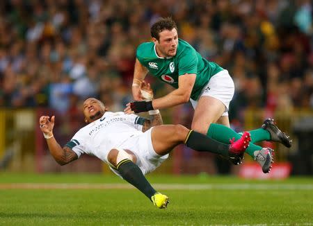 Rugby Union - Rugby Test - Ireland v South Africa - Cape Town South Africa - 11/06/16. South Africa's Elton Jantjies is tackled by Ireland's Robbie Henshaw. REUTERS/Mike Hutchings