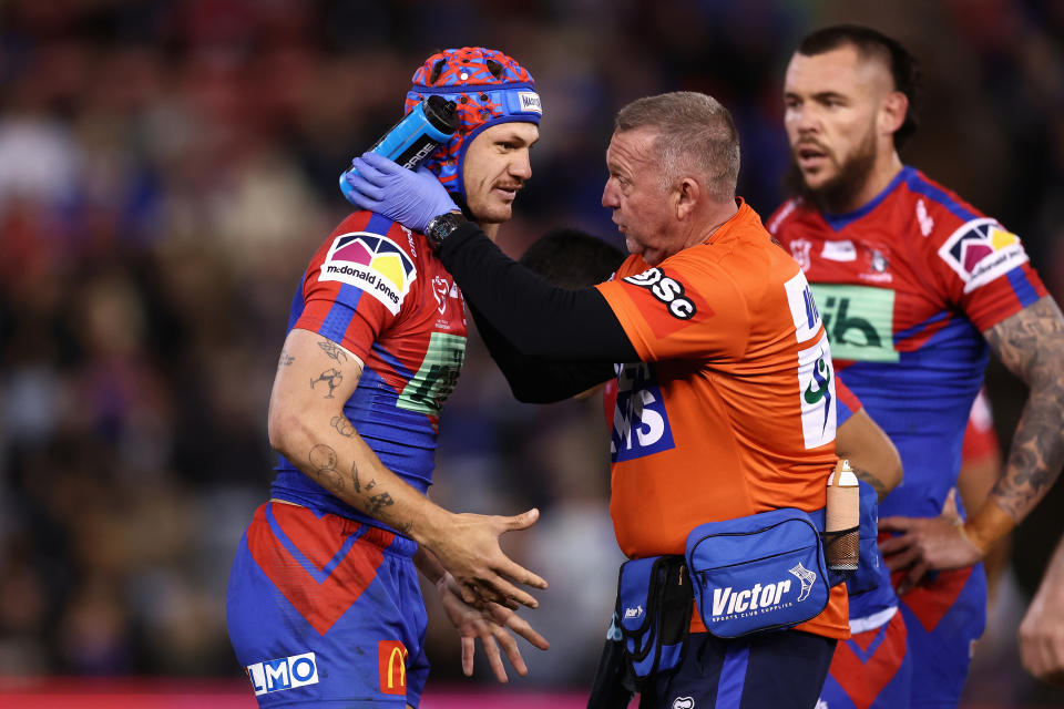 Kalyn Ponga, pictured here receiving attention after being tackled high by Matt Lodge.