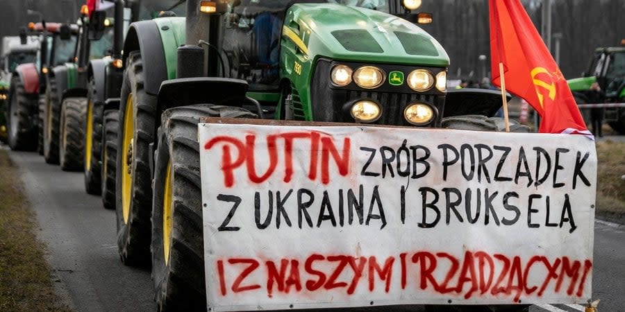 A poster on a tractor with an appeal to Russian dictator Vladimir Putin