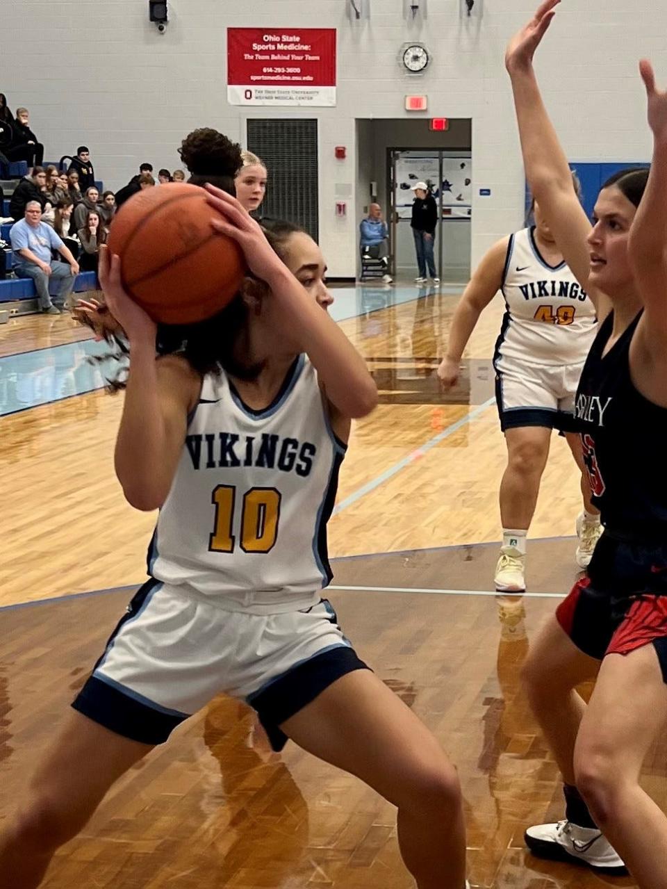 River Valley's Eva Moran gets stopped along the baseline by the Bishop Hartley defense during a Division II girls basketball district semifinal game at Olentangy Berlin Wednesday night.