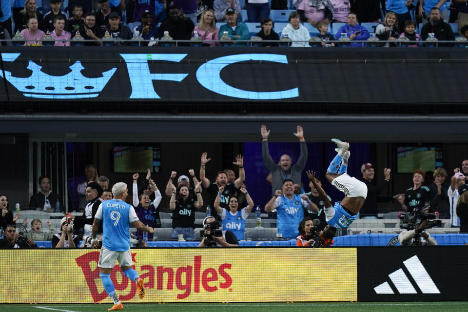 Charlotte FC forward Kerwin Vargas, right, with forward Enzo Copetti (9) celebrates after his goal during the first half of an MLS soccer match against Inter Miami, Saturday, Oct. 21, 2023, in Charlotte, N.C. (AP Photo/Erik Verduzco)