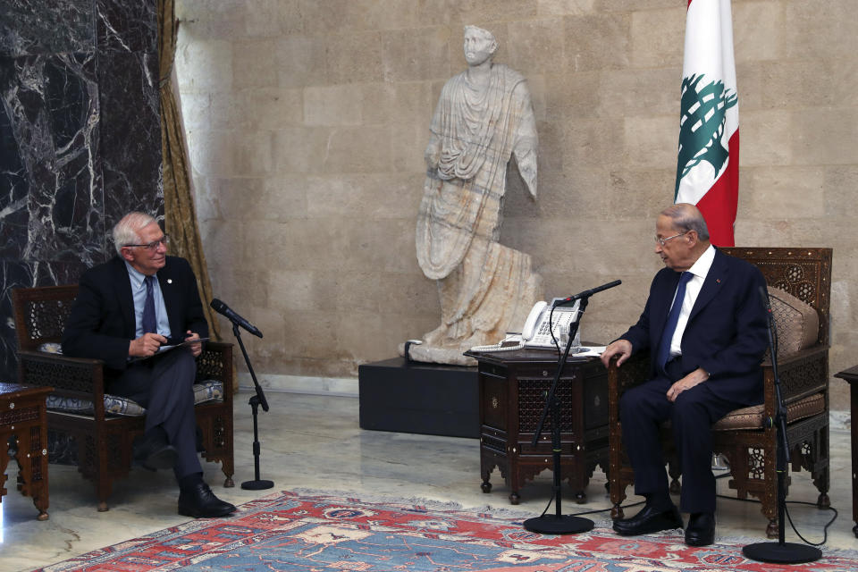 In this photo released by Lebanese government, Lebanese President Michel Aoun, right, meets with European Union foreign policy chief Josep Borrell at the Presidential Palace in Baabda, east of Beirut, Lebanon, Saturday, June. 19, 2021. Borrell berated Lebanese politicians for delays in forming a new Cabinet, warning the union could impose sanctions on those behind the political stalemate in the crisis-hit country. (Dalati Nohra/Lebanese Official Government via AP)