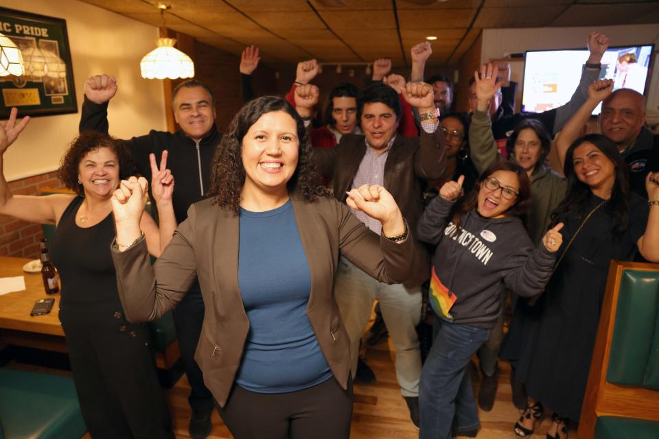 Rita Mendes, center, celebrates at Home Cafe after she wins the 11th Plymouth state representative seat on Tuesday, Nov. 8, 2022.