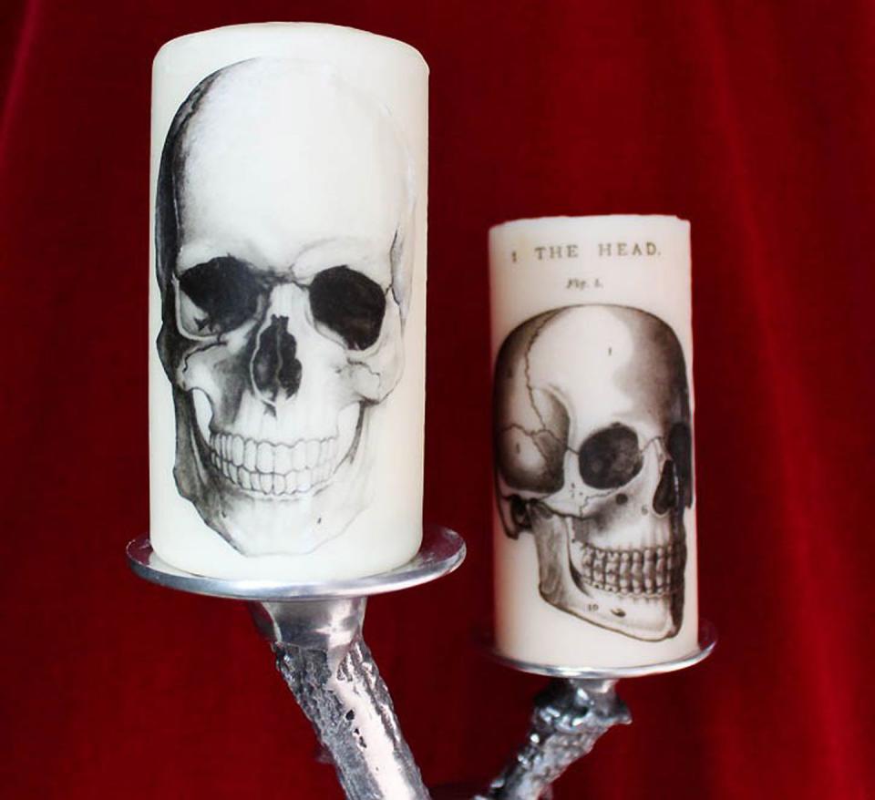 <p>You can customize these gruesome finds with your favorite spooky images.</p><p><strong>Get the tutorial at <a href="http://gina-michele.com/2014/10/diy-printed-halloween-candles-2.html#more" rel="nofollow noopener" target="_blank" data-ylk="slk:Gina Michelle;elm:context_link;itc:0;sec:content-canvas" class="link ">Gina Michelle</a>.</strong><br></p><p><a class="link " href="https://www.amazon.com/Yummi-White-Round-Pillar-Candles/dp/B014G6RBGY/?th=1&tag=syn-yahoo-20&ascsubtag=%5Bartid%7C10050.g.22221887%5Bsrc%7Cyahoo-us" rel="nofollow noopener" target="_blank" data-ylk="slk:SHOP CANDLES;elm:context_link;itc:0;sec:content-canvas">SHOP CANDLES</a><br></p>