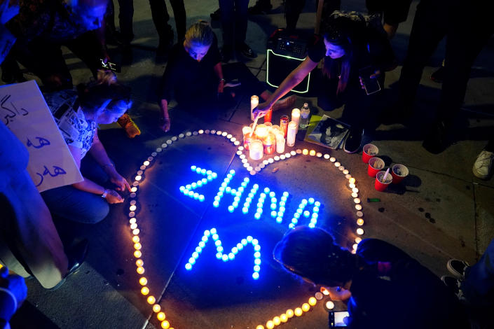 <p>Demonstrators at a candlelight vigil following the death of a young Iranian Kurdish woman, Mahsa (Zhina) Amini, outside the Wilshire Federal Building in Los Angeles, California, U.S., September 22, 2022. REUTERS/Bing Guan</p> 