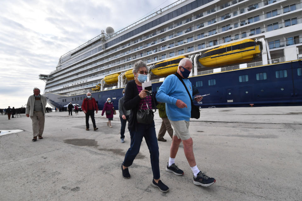 Cruise tourists arrive on March 23, 2022 at the port of La Goulette in Tunis as Tunisia welcomes the first cruise from Europe, with more than 800 tourists on board, after a stop recorded since 2019 due to the Covid-19 pandemic. - Tunisia expects to welcome a total of 44 cruises during the year 2022, recalling that in 2010, Tunisia welcomed 1 million tourists coming in cruises . (Photo by FETHI BELAID / AFP) (Photo by FETHI BELAID/AFP via Getty Images)