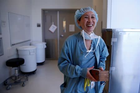 Neurosurgeon Linda Liau, MD, 49, Professor and Director of the UCLA Brain Tumor Program walks out of the operating theatre after successfully removing a tumour from a patient at the Ronald Reagan UCLA Medical Center in Los Angeles, California, United States, May 26, 2016. REUTERS/Lucy Nicholson