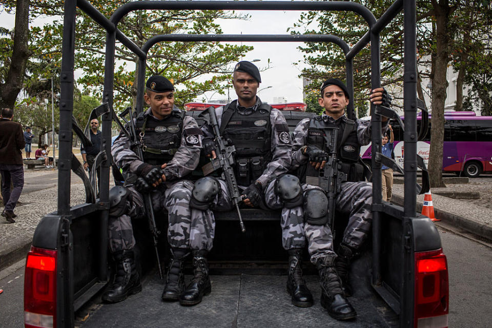 Military police in Rio de Janeiro's Olympic flame convoy. (Chris McGrath/Getty Images)