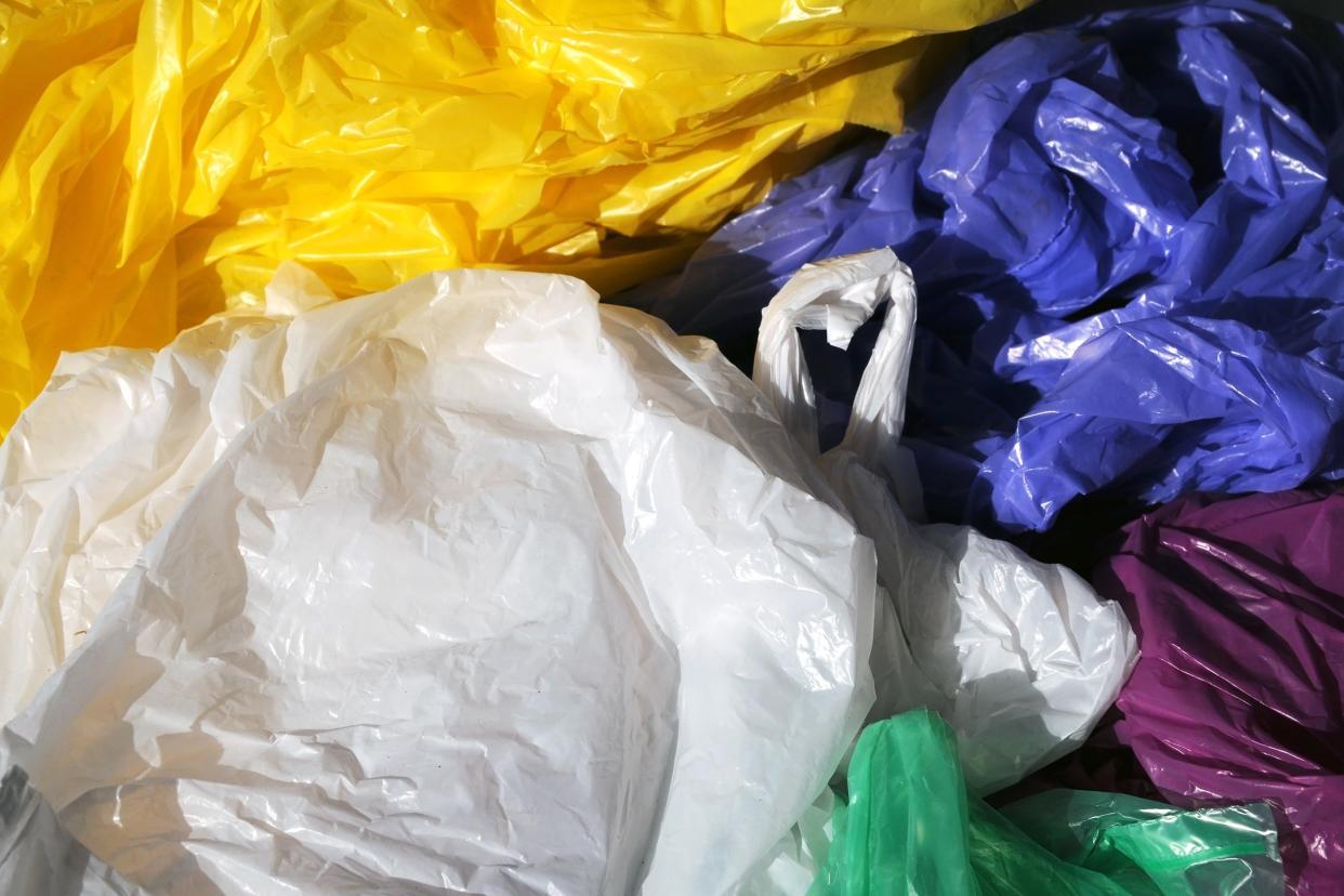 separated colorful used plastic shopping bags for waste collection