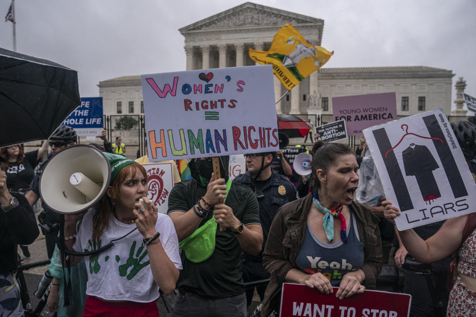 Abortion rights activists chant during a rally in front of the Supreme Court in June.