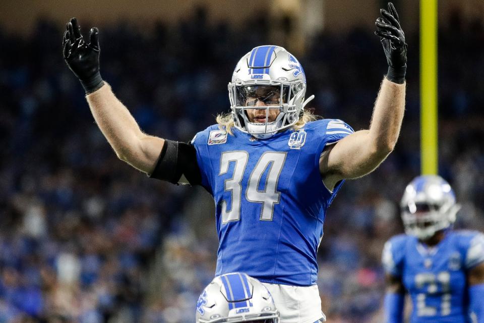 Lions linebacker Alex Anzalone waves at fans before a play during the second half of the Lions' 42-24 win on Sunday, Oct. 8, 2023, at Ford Field.