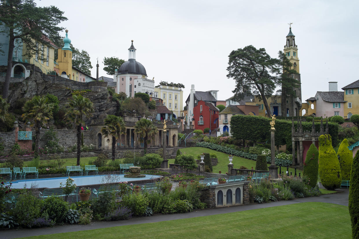 PORTMEIRION - WALES - JUNE 26: A general view over the tourist town of Portmeirion on June 26, 2019 in Portmeirion, North Wales. The village was designed and built by Sir Clough Williams-Ellis between 1925 and 1975 in the style of an Italian village. The town became  famous as 'The Village', the setting for the 1967 TV series 'The Prisoner', and is also well known for it's pottery. (Photo by Dan Kitwood/Getty Images)