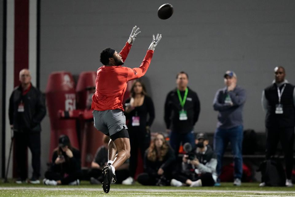 Ohio State Buckeyes wide receiver Xavier Johnson catches passes from quarterback C.J. Stroud during Ohio State football’s pro day at the Woody Hayes Athletic Center in Columbus on March 22, 2023. 